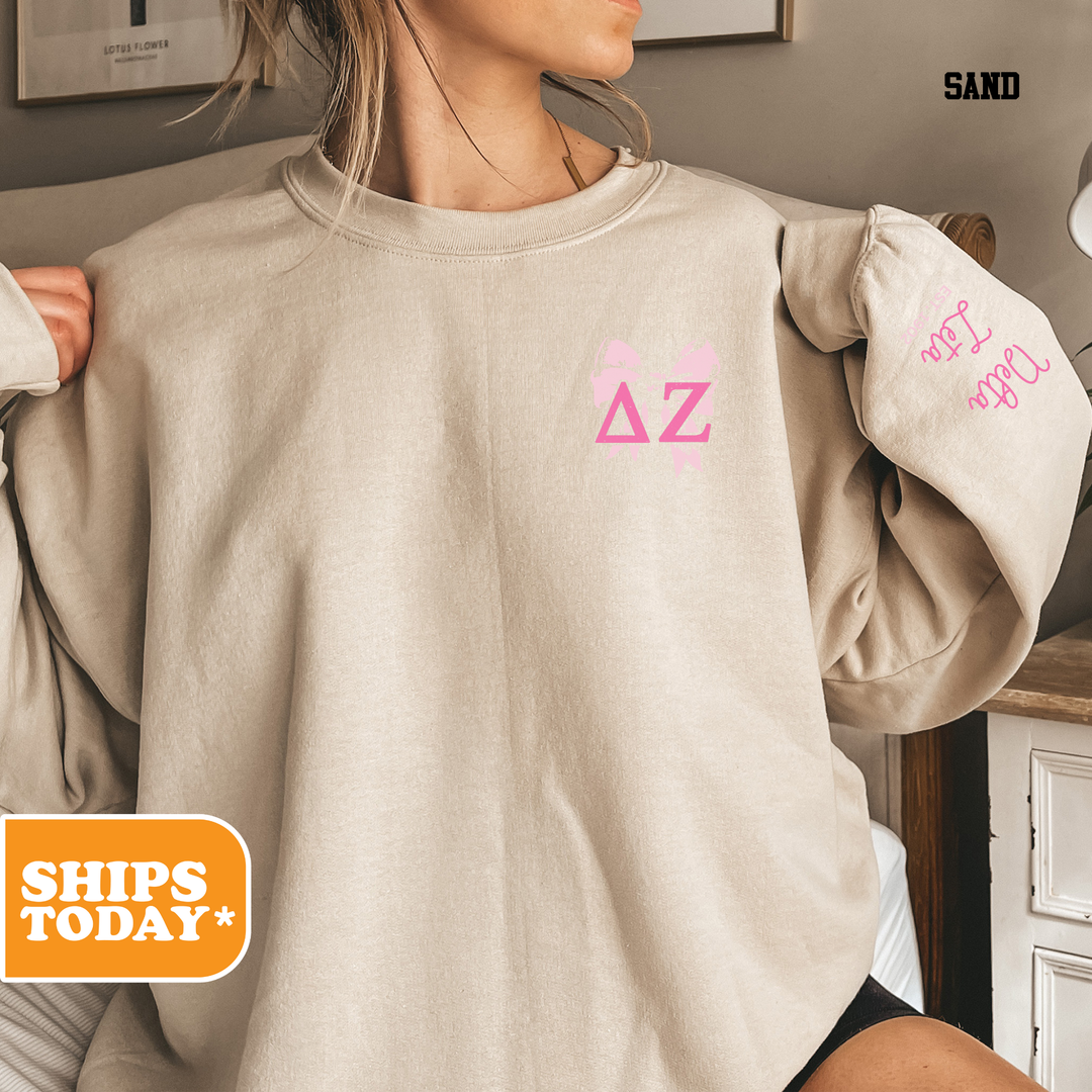a woman wearing a sweatshirt with pink letters on it