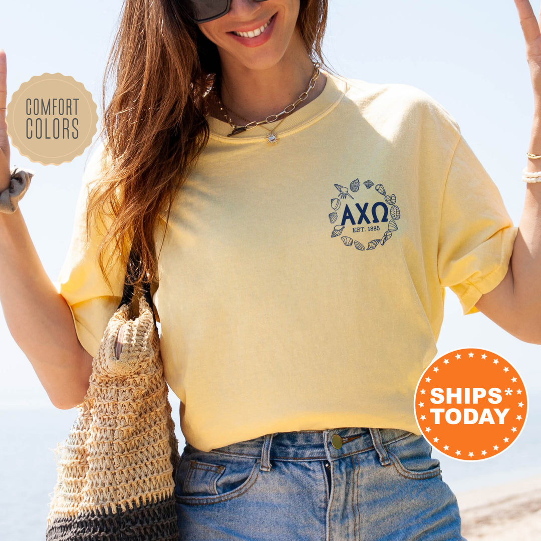 a woman in a yellow shirt holding up a peace sign