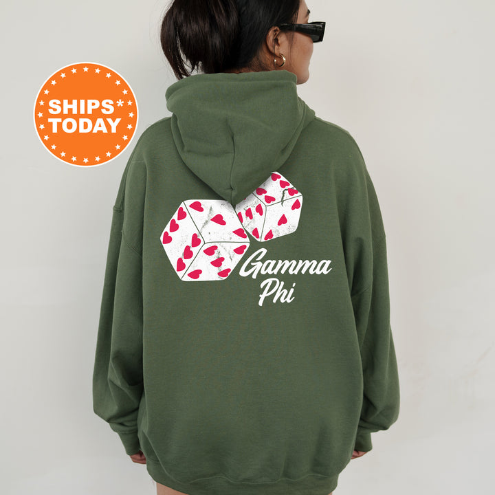 a woman wearing a green hoodie with a pair of dices on it