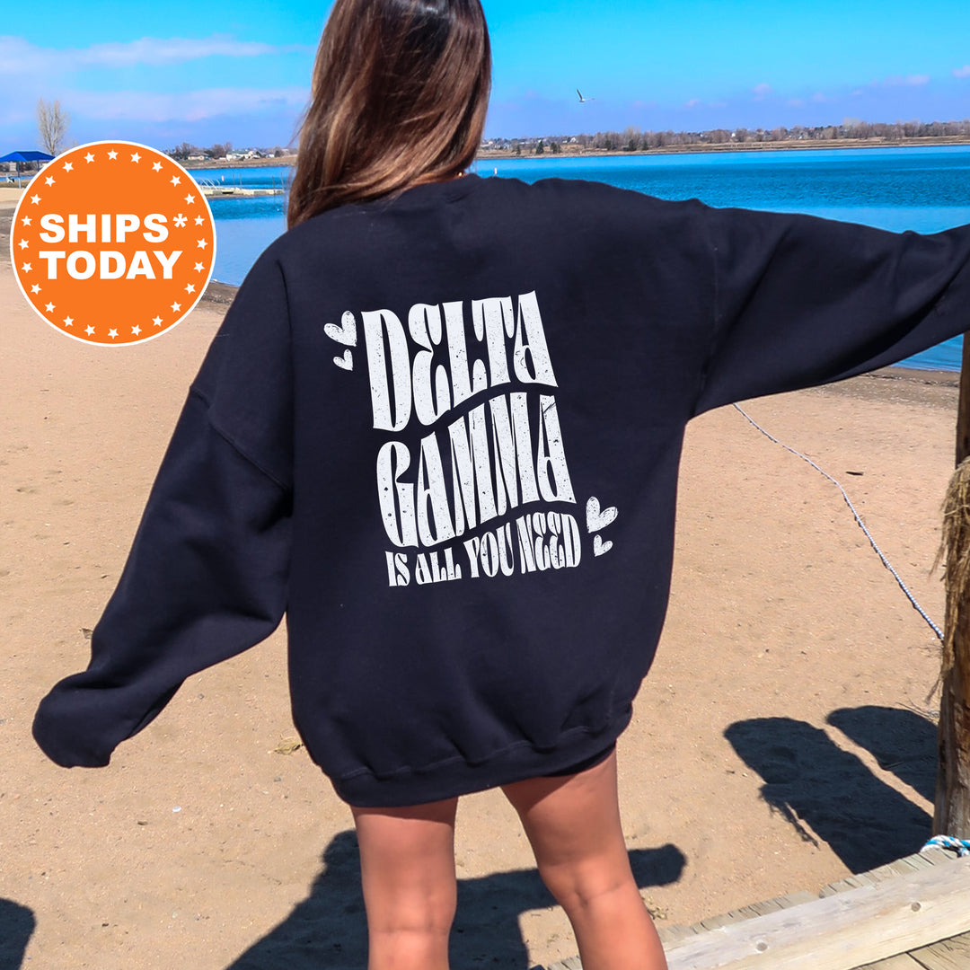 a woman wearing a sweatshirt that says delta gaming is all you need