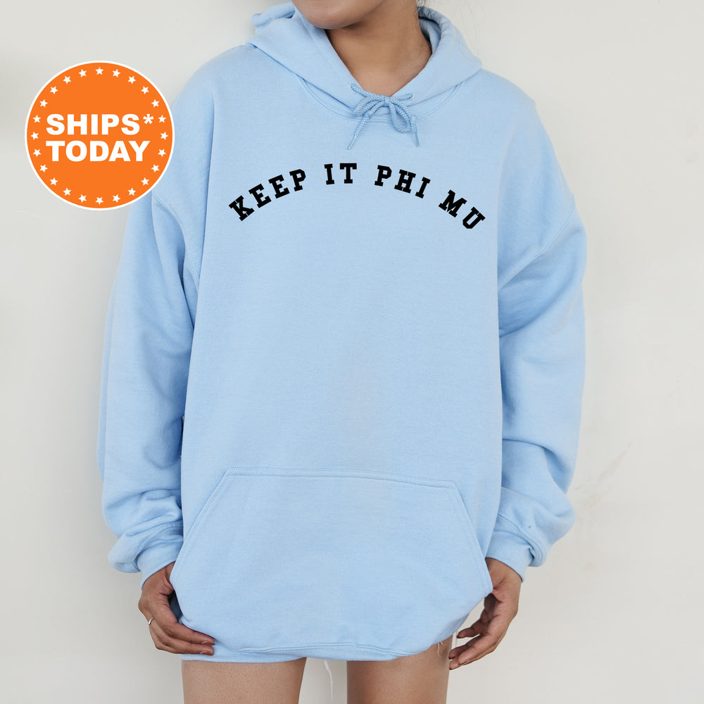 a woman wearing a blue hoodie with the words keep it prim on it