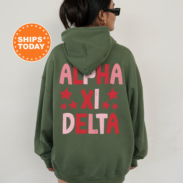 a woman wearing a green hoodie that says aloh xi delta