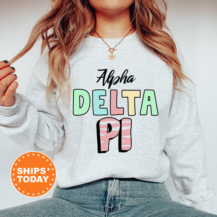 a woman wearing a sweatshirt with the words delta pi on it