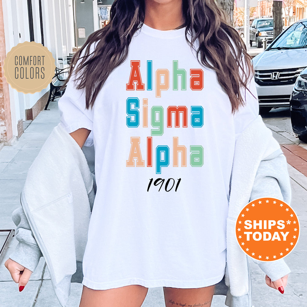 a woman wearing a white shirt with the words aloha sigmma al