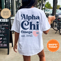 a woman walking down a sidewalk while wearing a white shirt