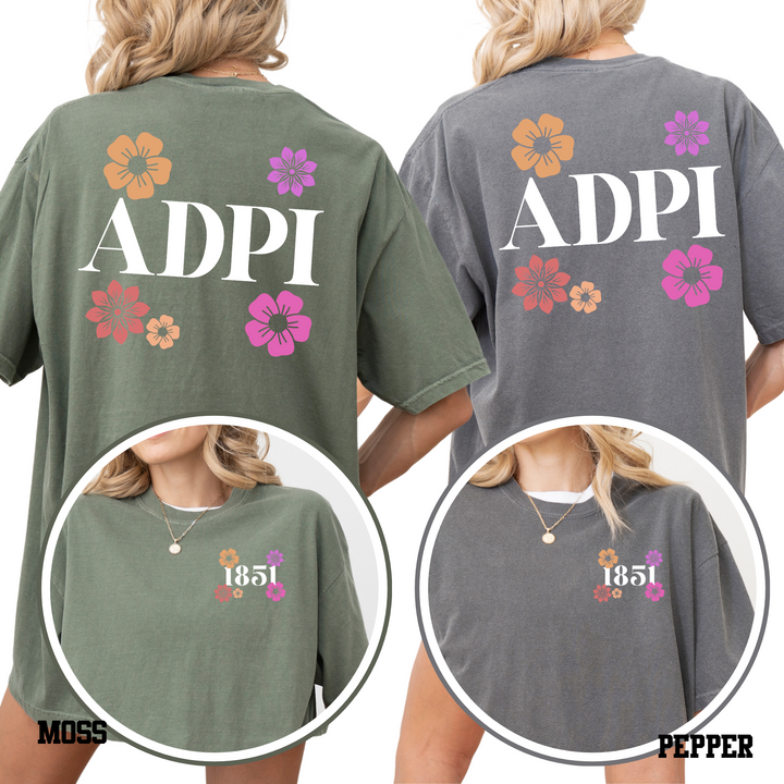 two women wearing t-shirts with the text "ADPI" printed on them.