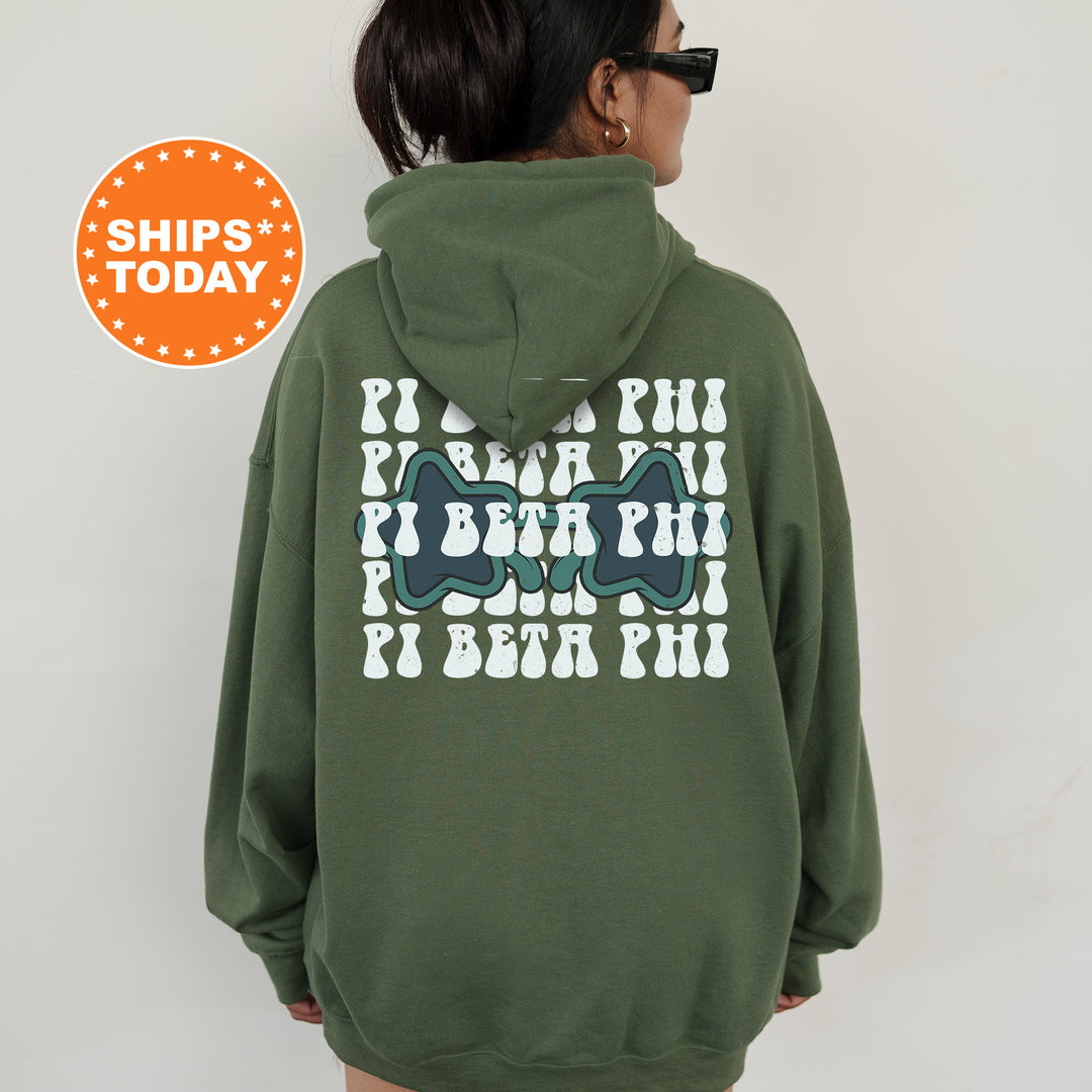 a woman wearing a green hoodie with an image of a pair of shoes on