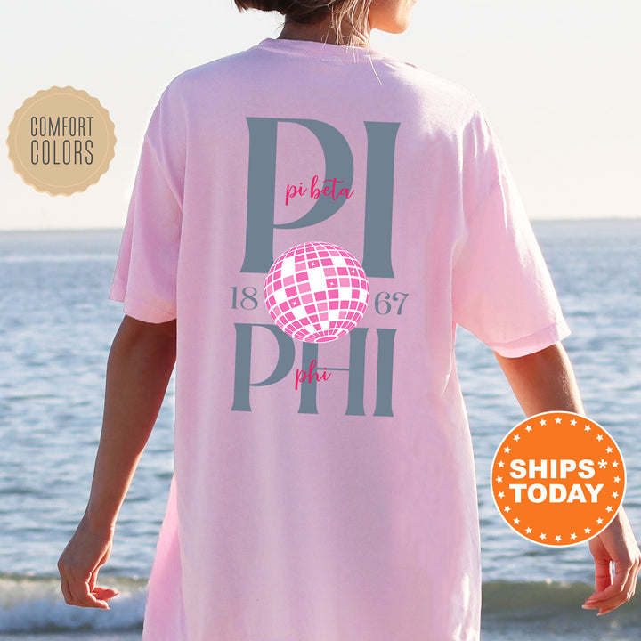a woman wearing a pink shirt with the words phi phi on it