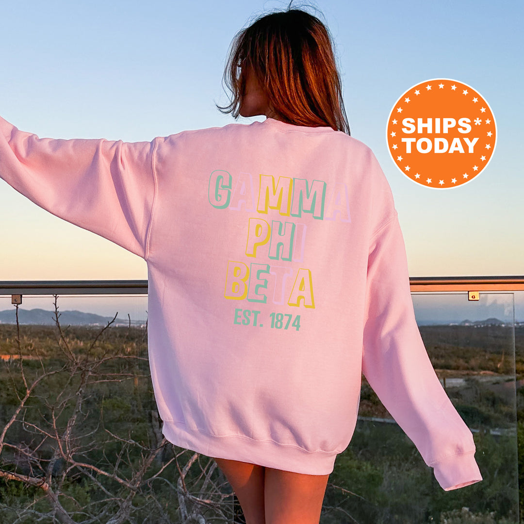 a woman in a pink sweatshirt is walking away from the camera