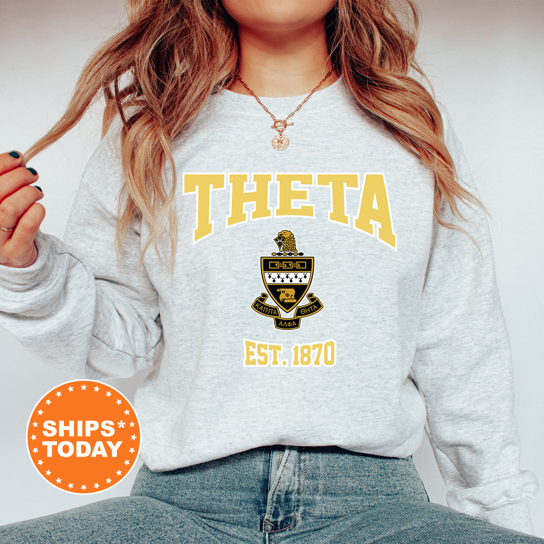 a woman wearing a sweatshirt with the words theta on it