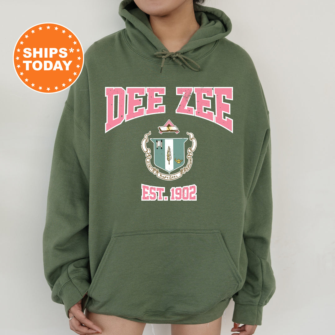 a person wearing a green hoodie with a red and white design on it
