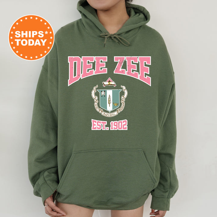 a person wearing a green hoodie with a red and white design on it