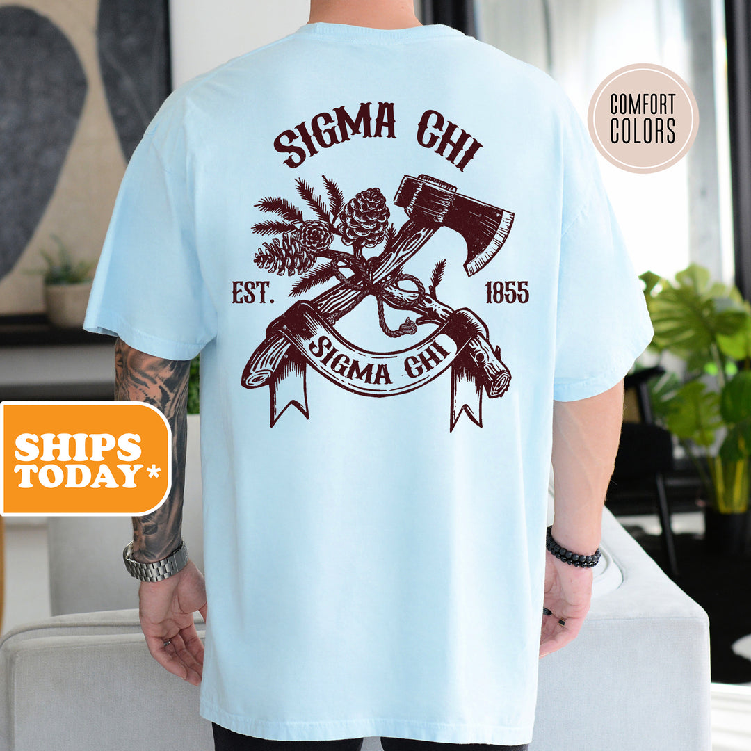 a man wearing a blue shirt with a hammer and pine tree on it
