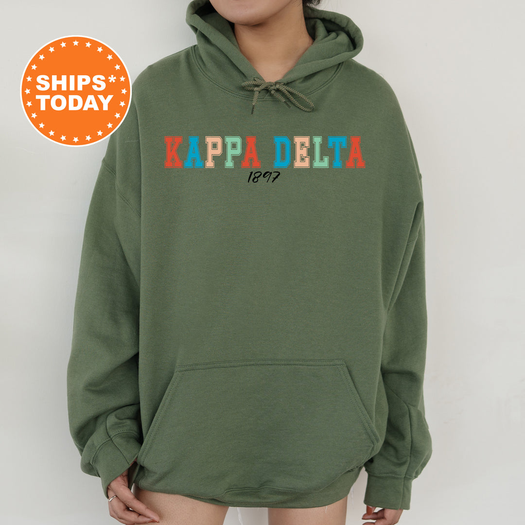 a woman wearing a green hoodie with the words kapadelia printed on