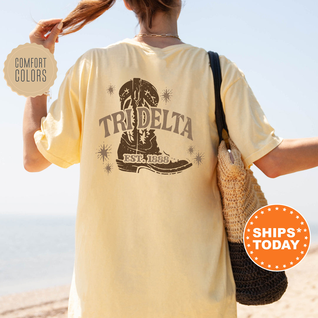 a woman walking on a beach holding a frisbee