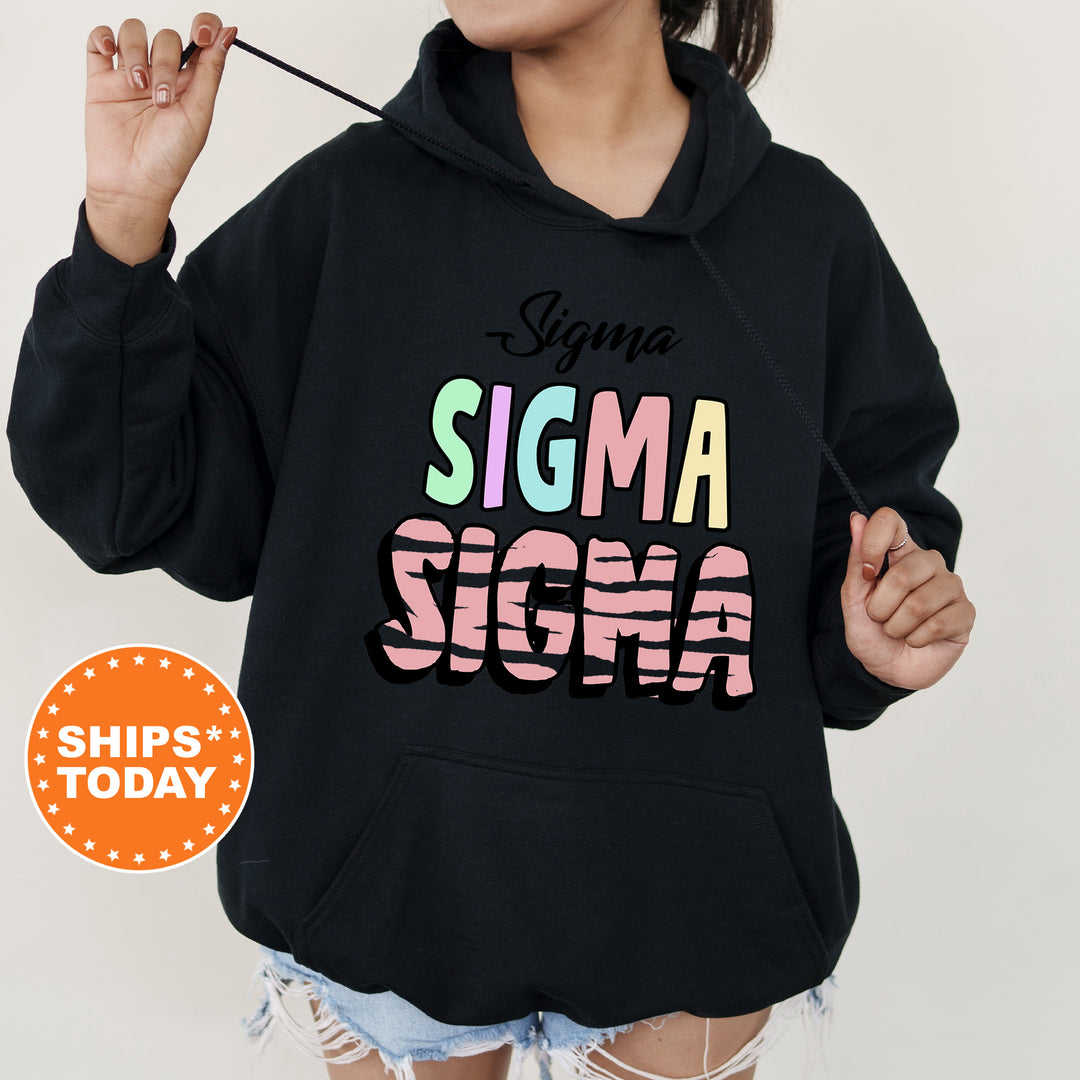 a woman wearing a black hoodie that says stigmaa stigmaa