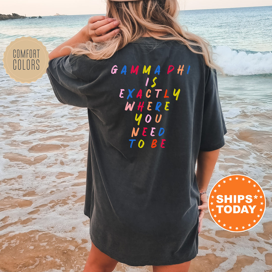 a woman standing on a beach wearing a shirt that says gummy is exactly where