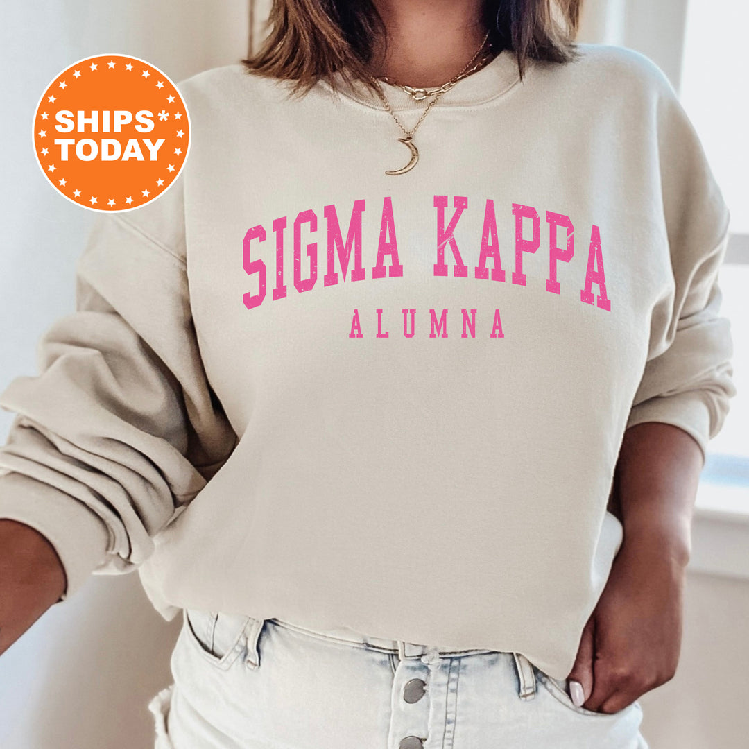 a woman wearing a sweatshirt that says stigmaa kapa