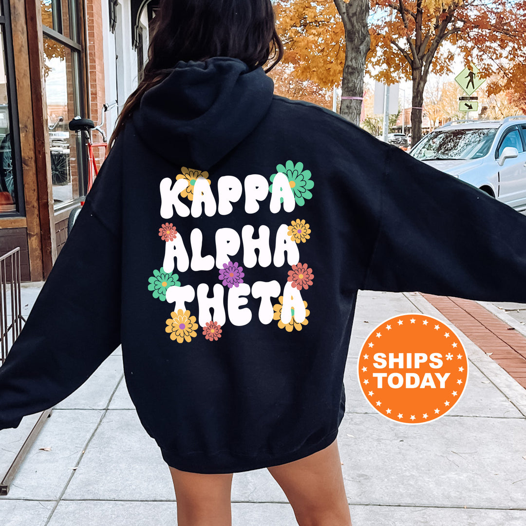 a woman wearing a black hoodie with the words kappa aloha