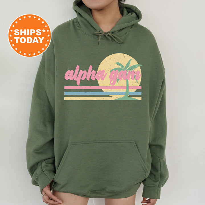 a person wearing a green hoodie with a palm tree on it