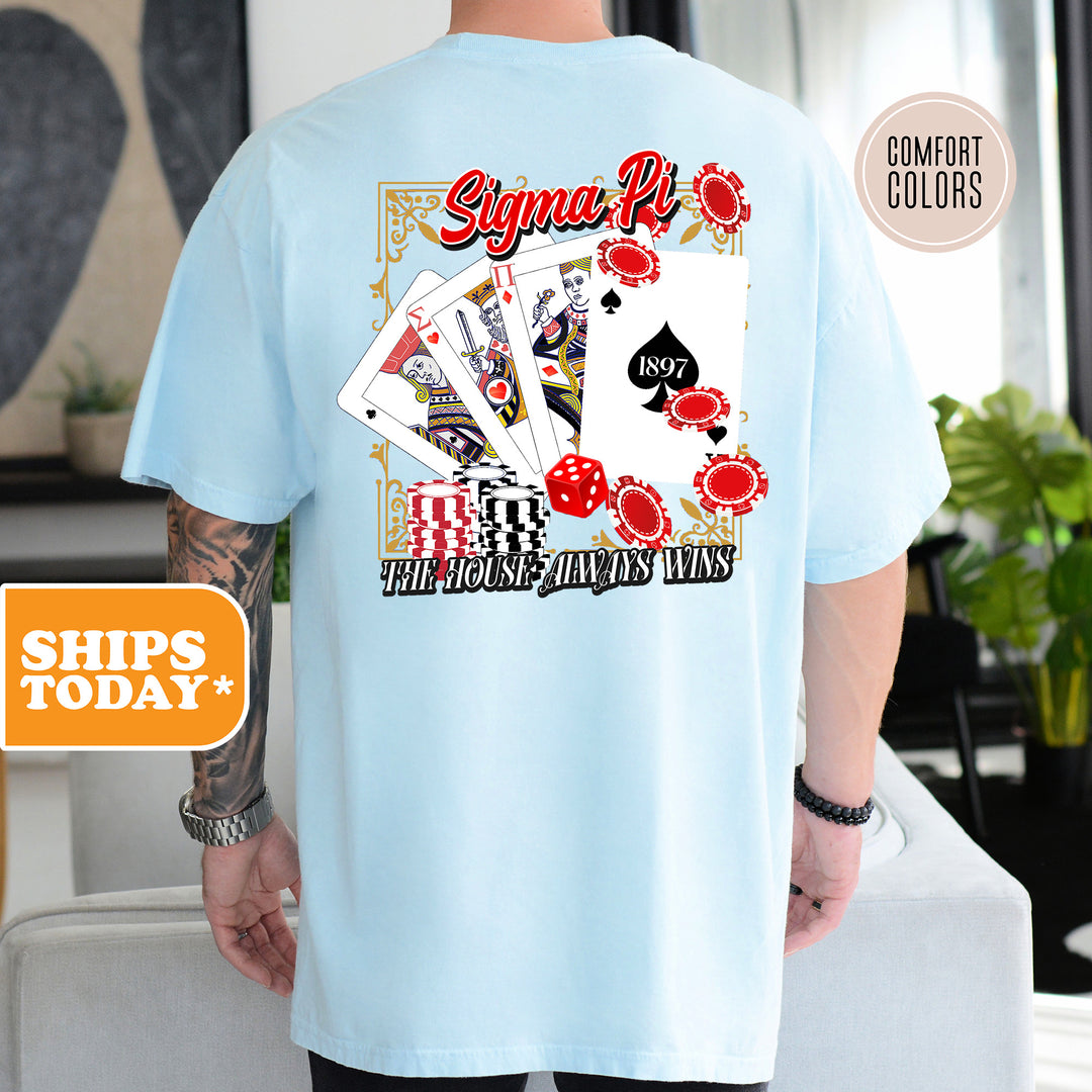 a man wearing a blue shirt with a picture of playing cards on it