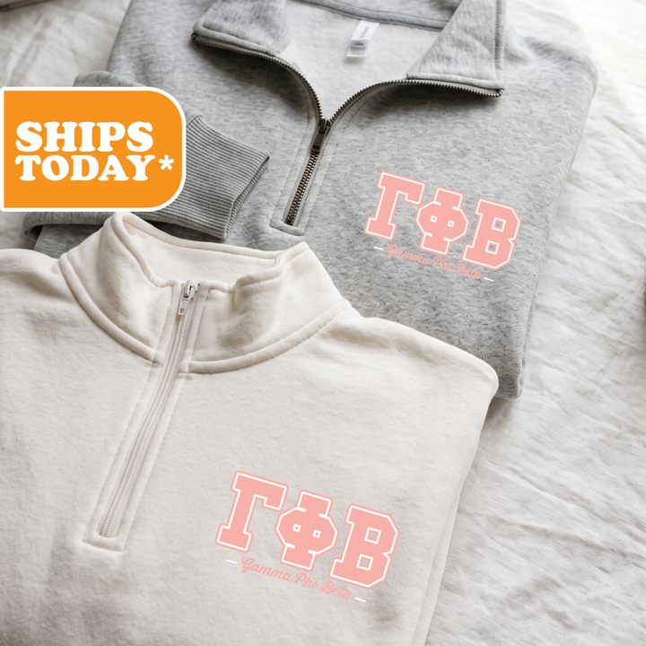 Two gray sweatshirts with the Greek letters 'ΦΑ' printed on them, along with the text 'ΤΑΓΟΡΕΙΑ' and 'ΤΑΓΟΡΕΙΑ' printed on them.