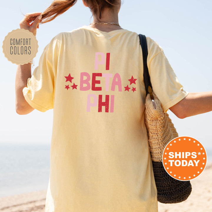 a woman is walking on the beach with her hair in a ponytail