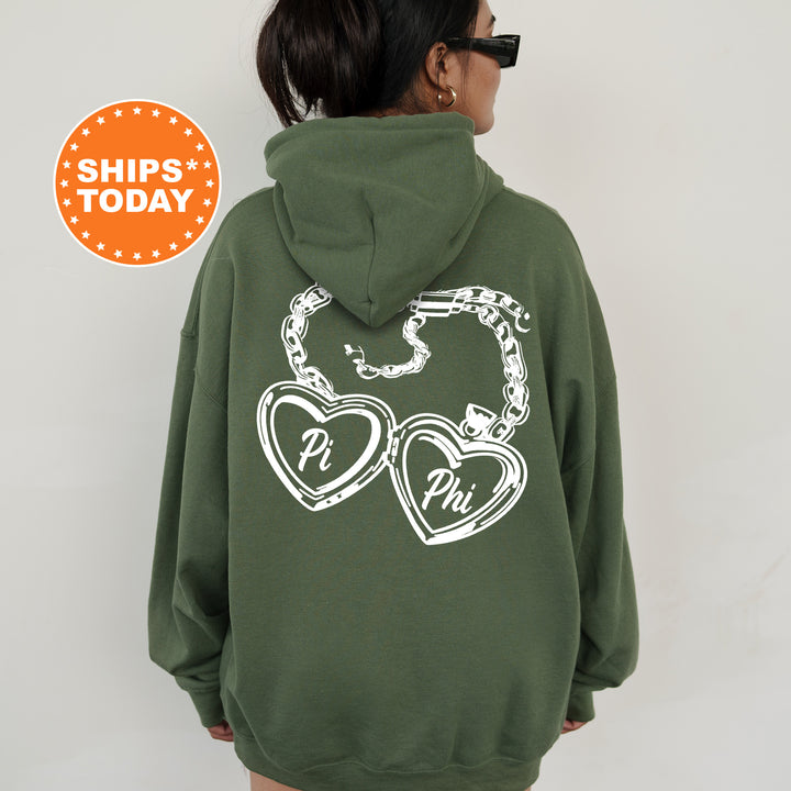 A person wearing a green hoodie with white text and graphics on the back.
