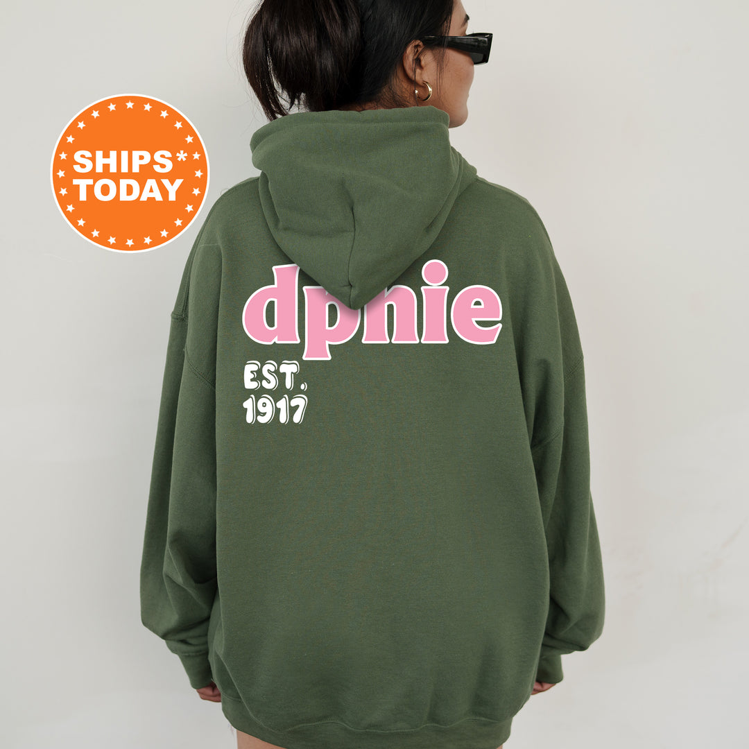 A person wearing a green hoodie with the text "dpnie" and "EST. 1917" printed on it.