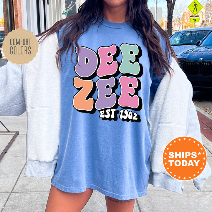 a woman is standing on the sidewalk wearing a t - shirt