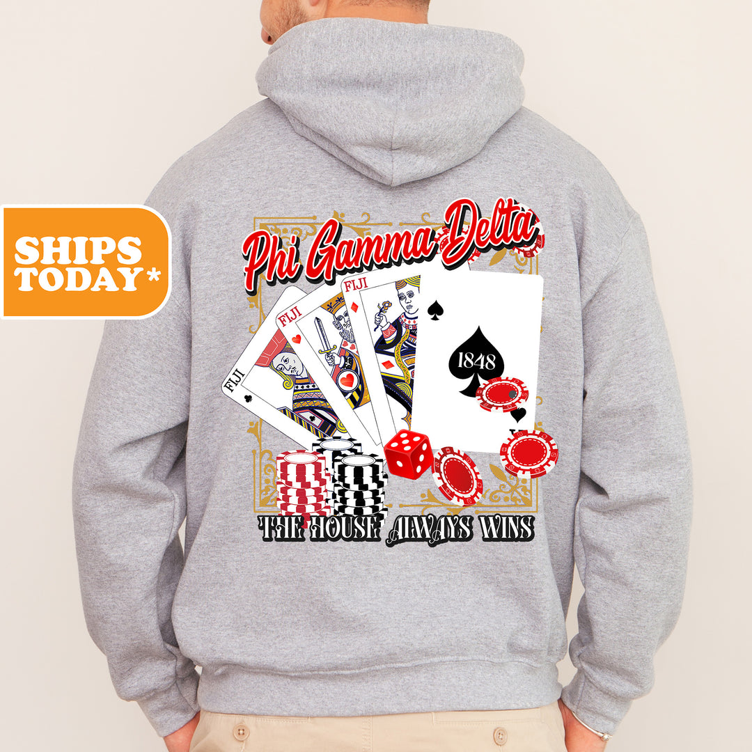 a man wearing a hoodie with a picture of playing cards on it