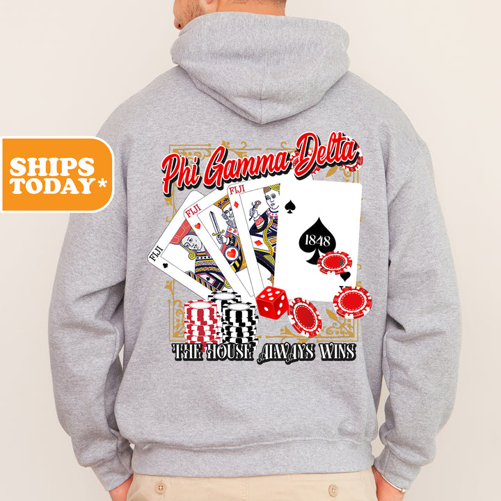 a man wearing a hoodie with a picture of playing cards on it