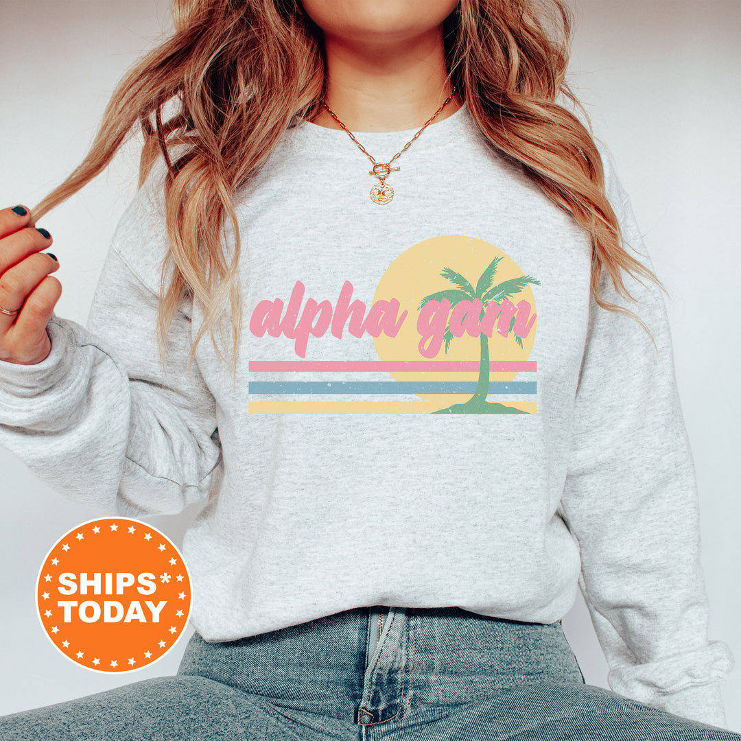 a woman wearing a sweatshirt with a palm tree on it