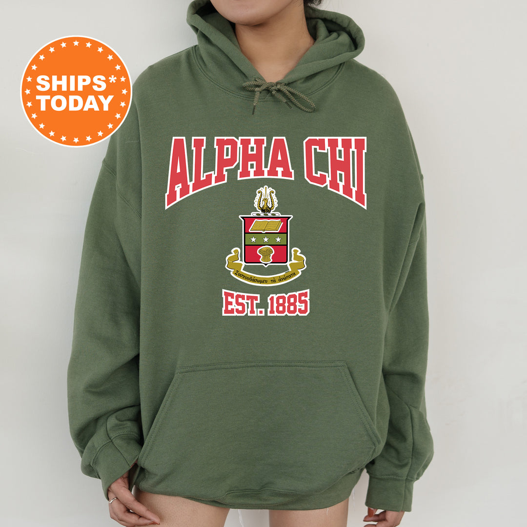 a person wearing a green hoodie with a red and yellow logo