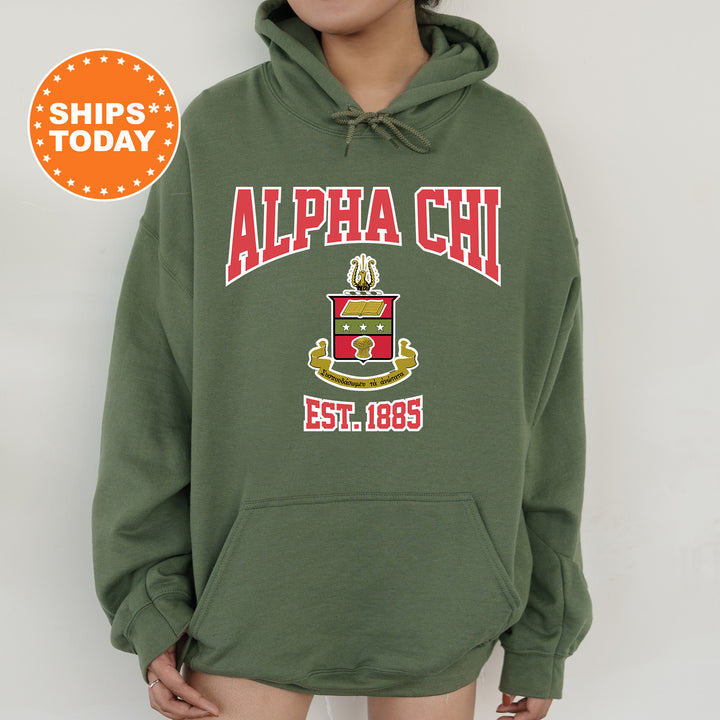 a person wearing a green hoodie with a red and yellow logo