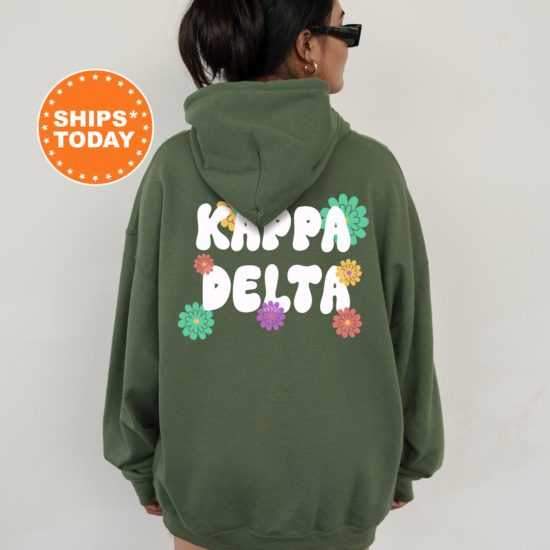 a woman wearing a green hoodie that says krippa delta