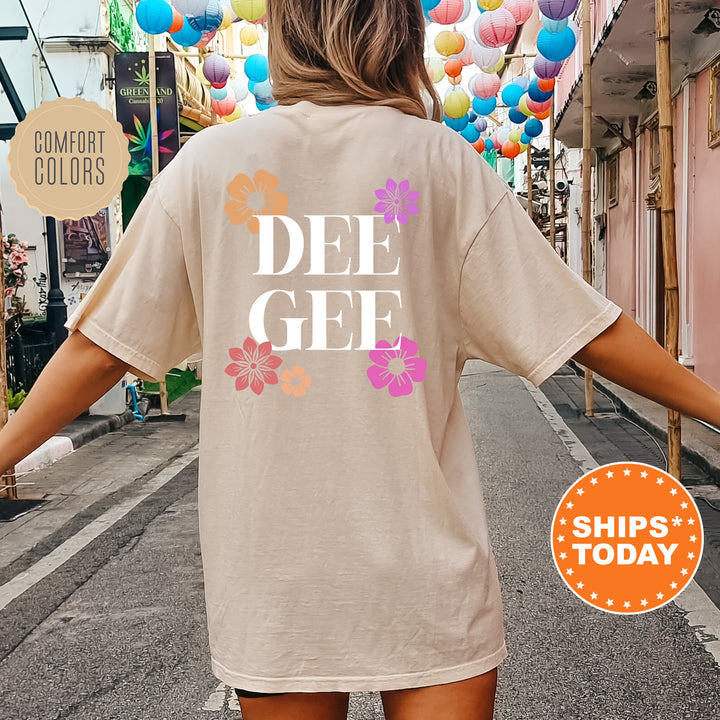 a woman walking down a street with a tee shirt on