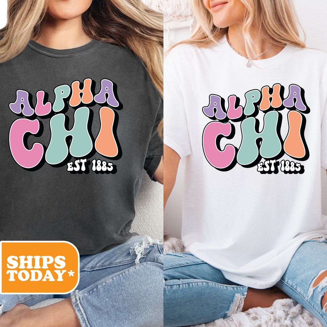 two women sitting on a bed wearing matching shirts