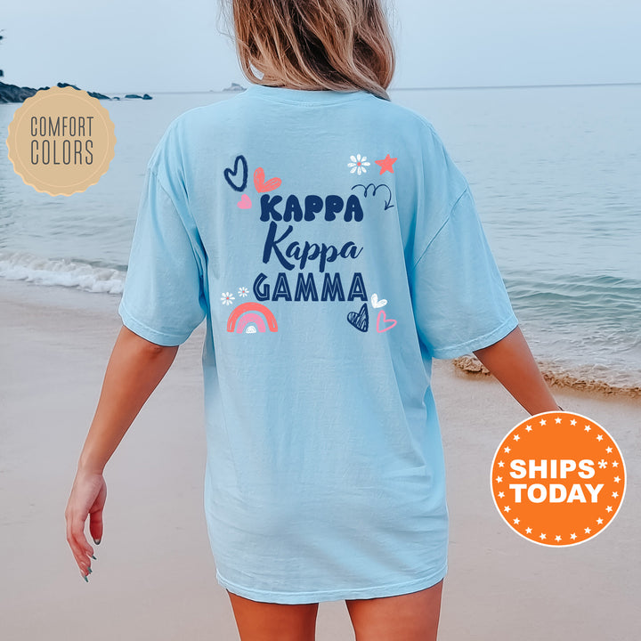 a woman walking on the beach wearing a shirt that says kapa kapa ga