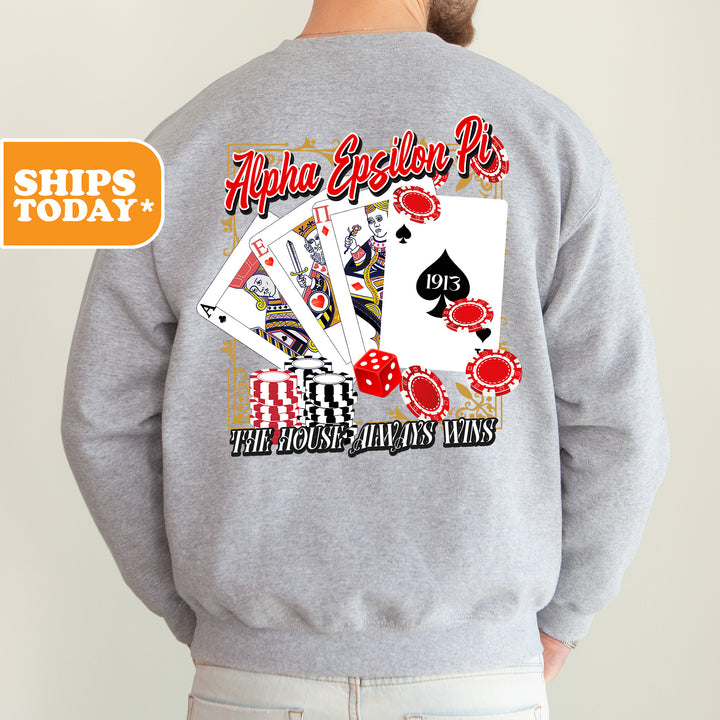 a man wearing a sweatshirt that has a picture of a playing card on it