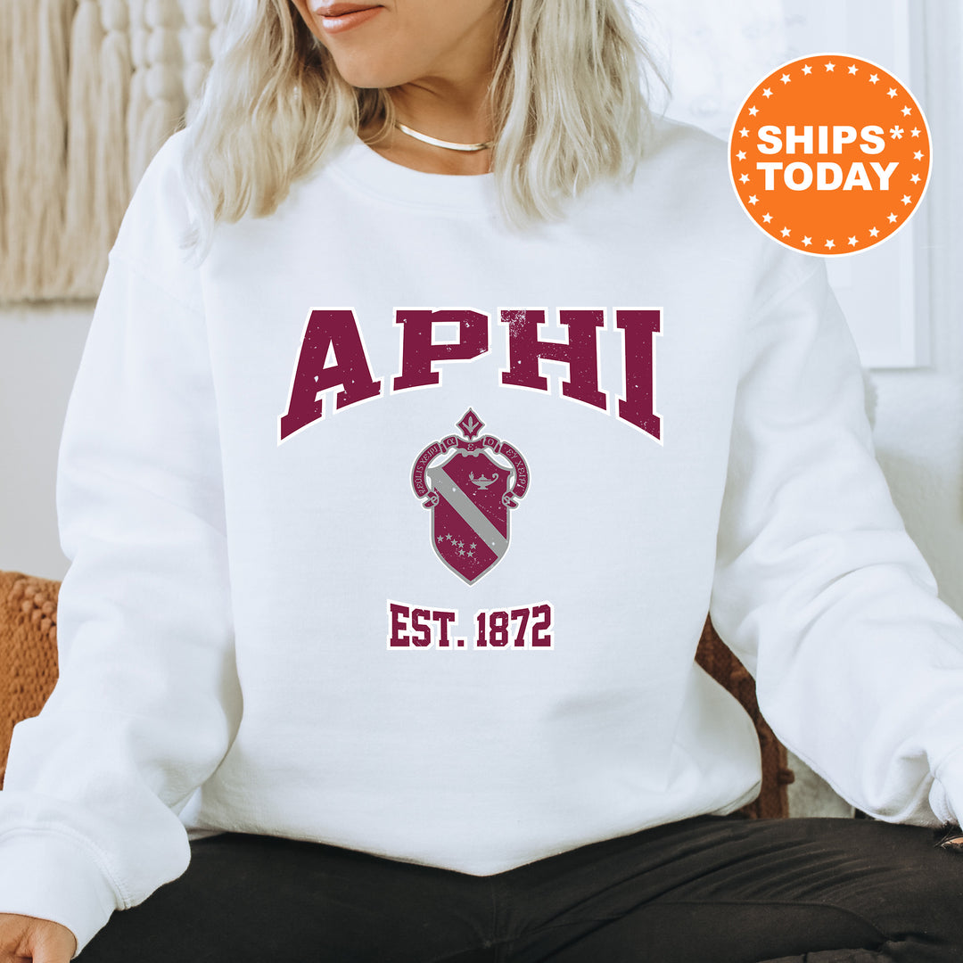 a woman sitting on a chair wearing a sweatshirt
