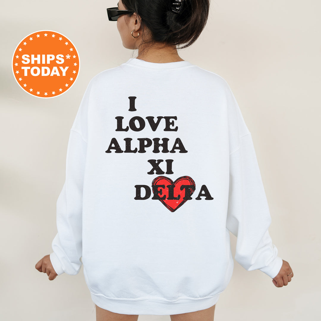 a woman wearing a sweatshirt that says i love alpha xi dega