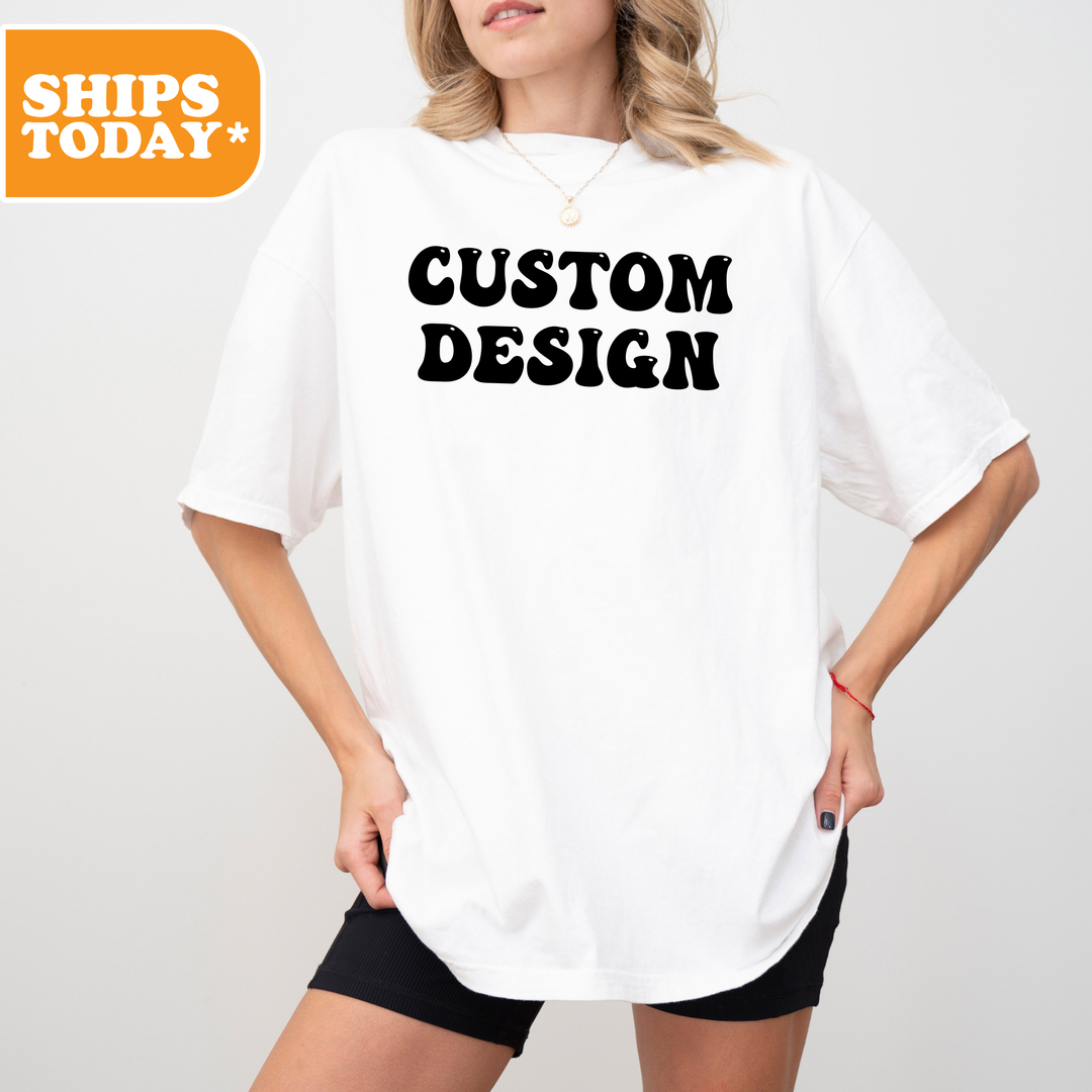A woman wearing a white t-shirt with the text "CUSTOM DESIGN" printed on it.