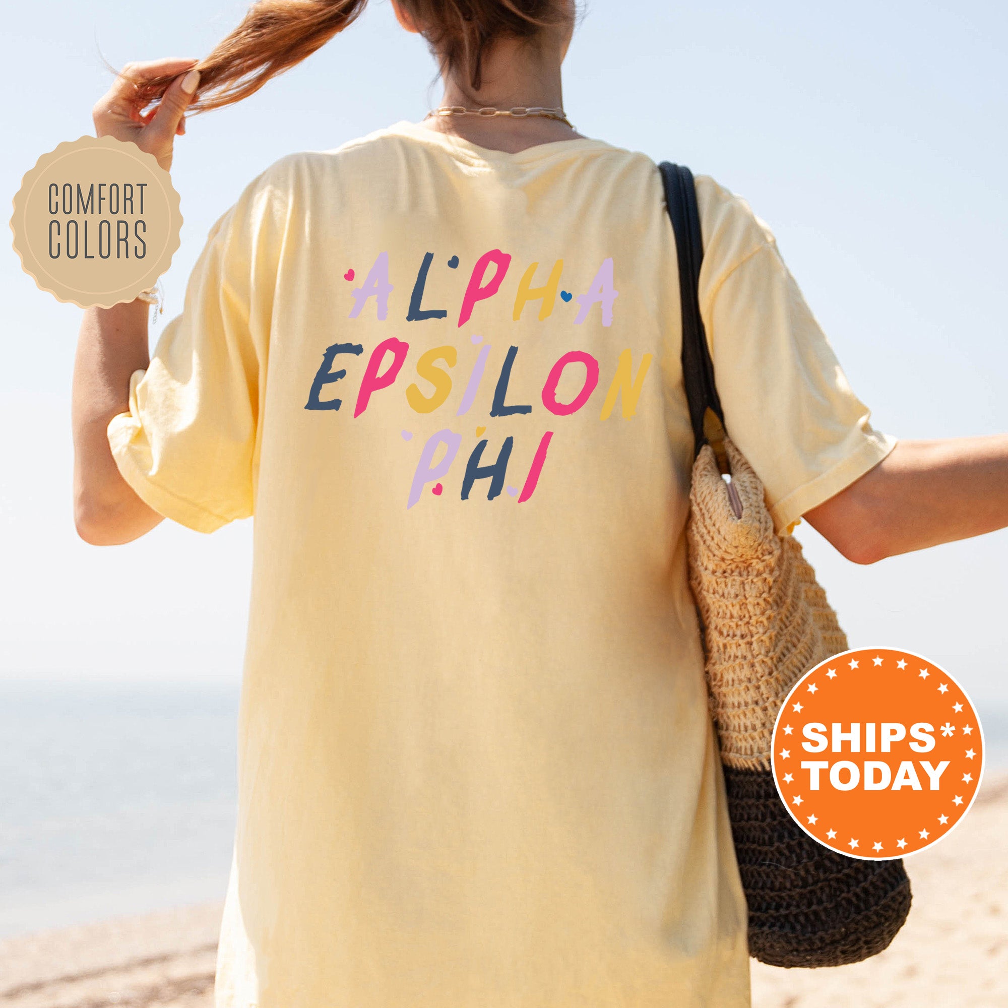 a woman walking on a beach holding a purse