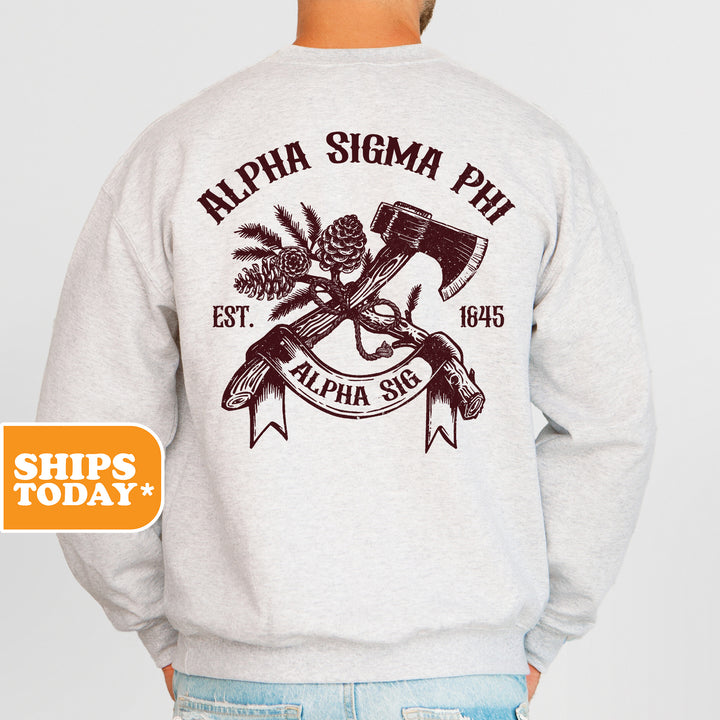 a man wearing a sweatshirt with a hammer and pine cones on it