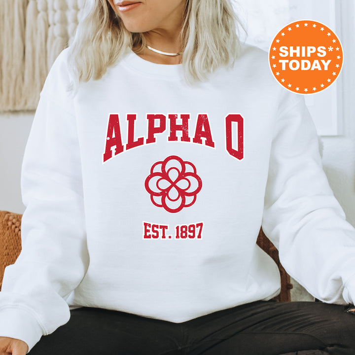 a woman sitting on a chair wearing a white sweatshirt