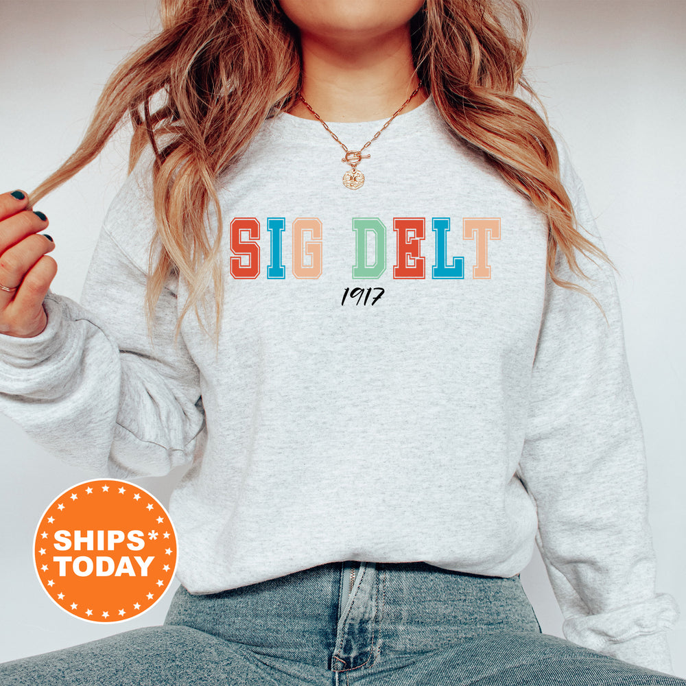 a woman with long hair wearing a sweatshirt and jeans