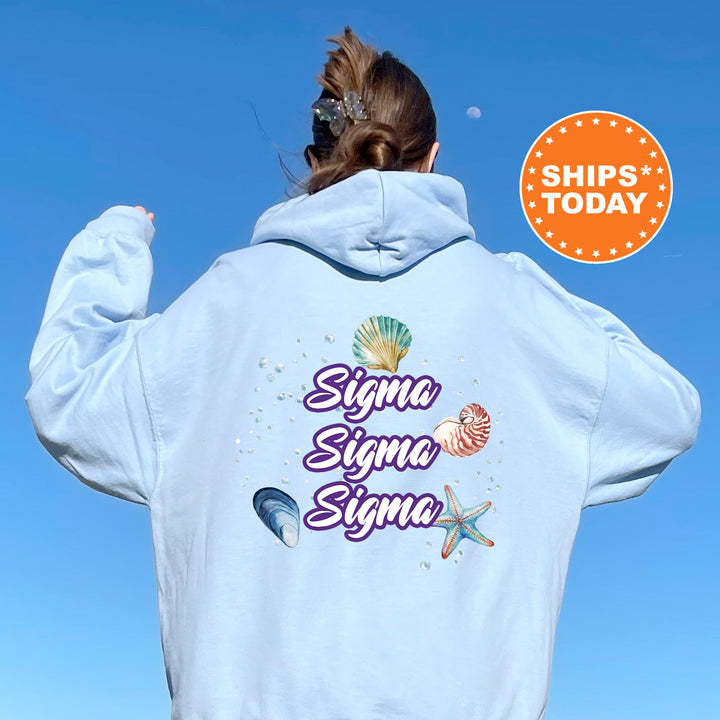 a woman wearing a white hoodie with the words singma singma singma