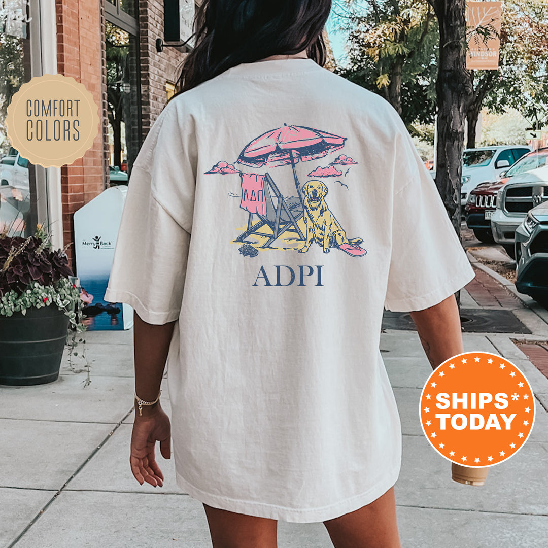 a woman walking down a sidewalk with an adpi shirt on