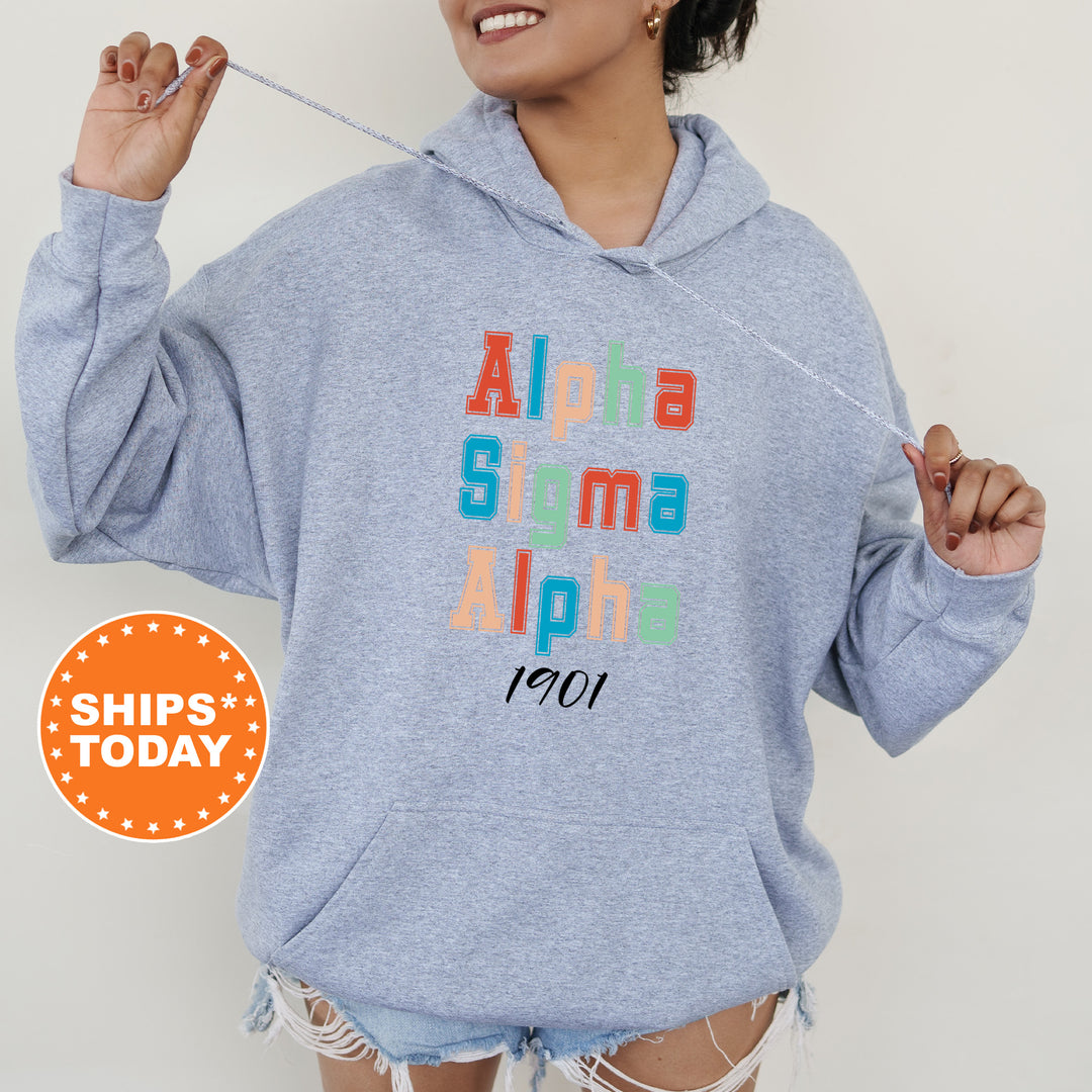 a woman wearing a blue sweatshirt with the words aloha shima aloh